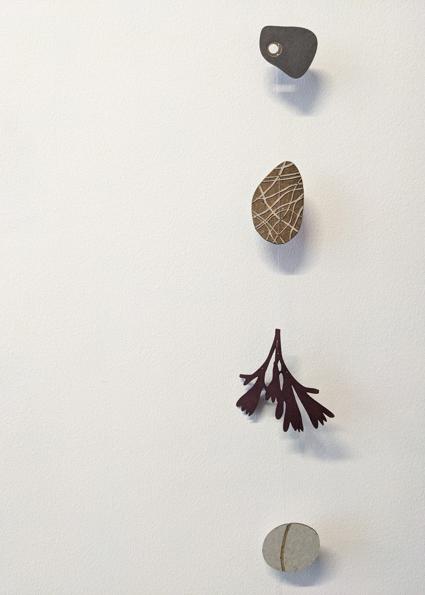 a small collection of paper pebbles & seaweed