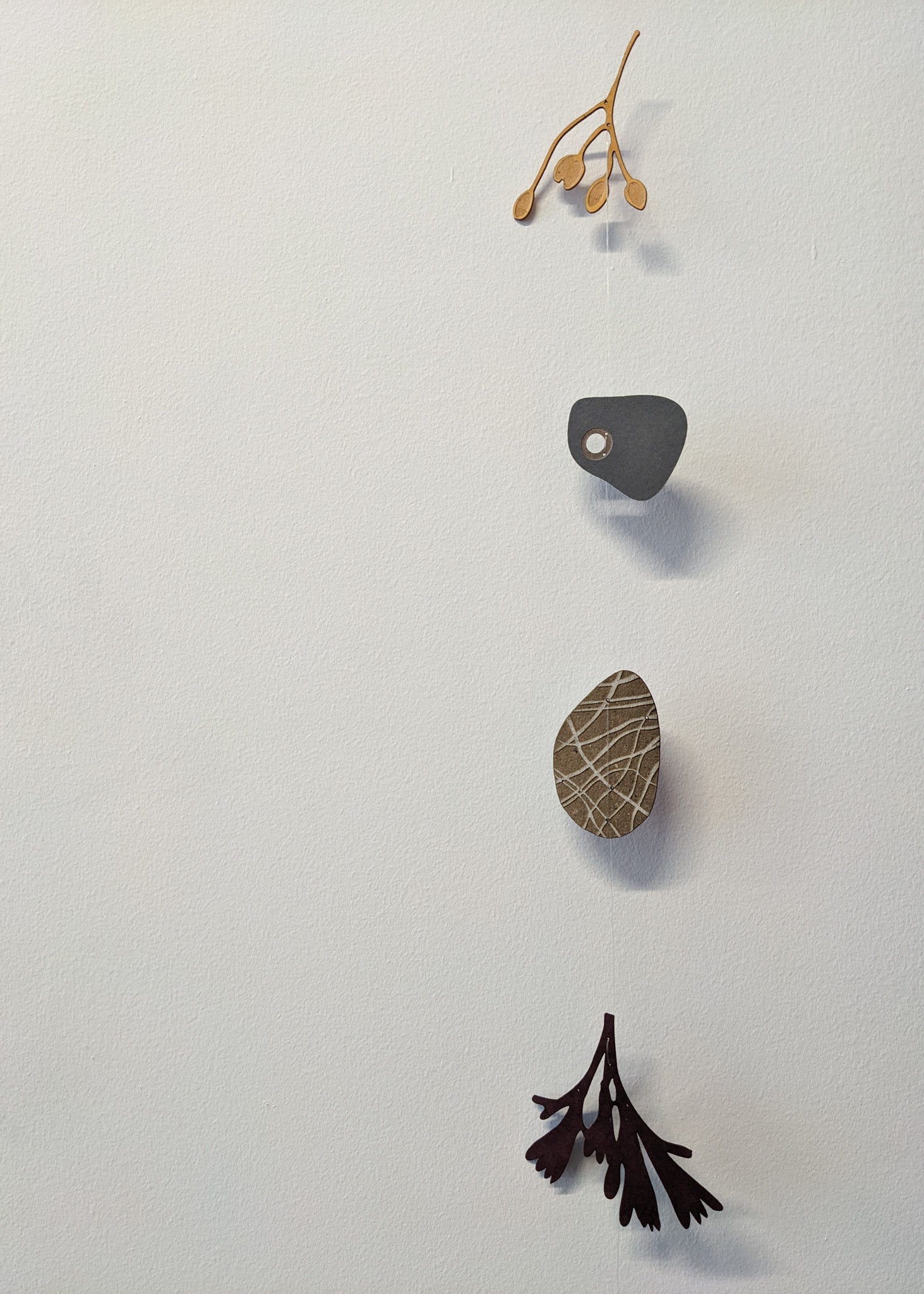 a small collection of paper pebbles & seaweed