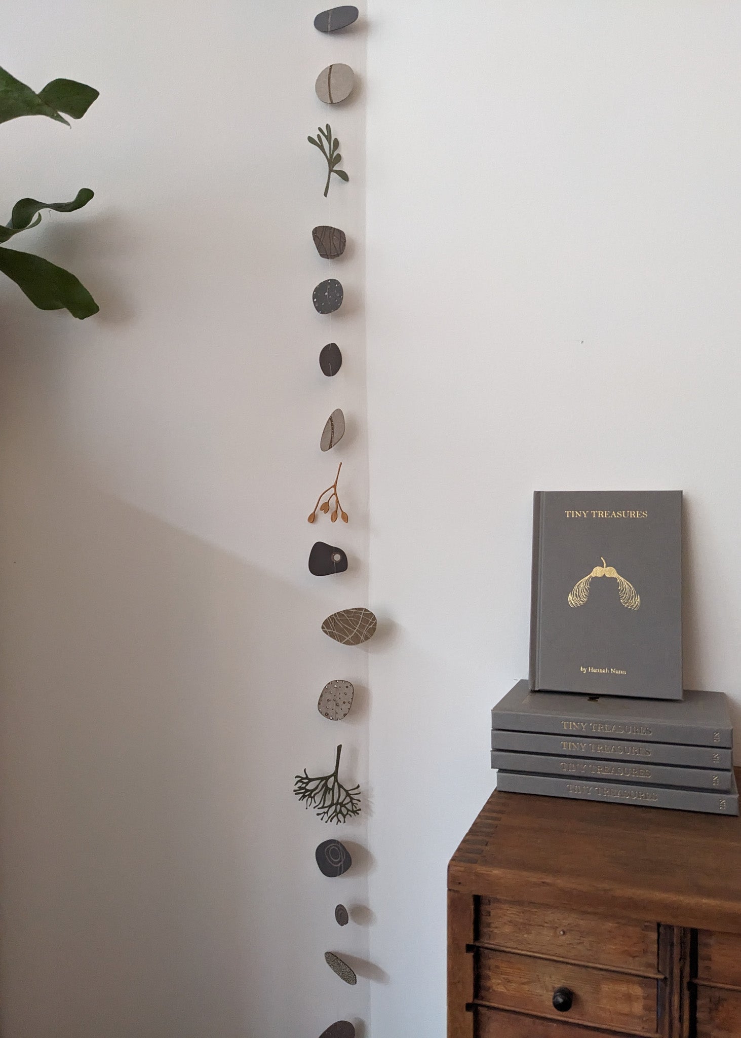 a large collection of paper pebbles & seaweed